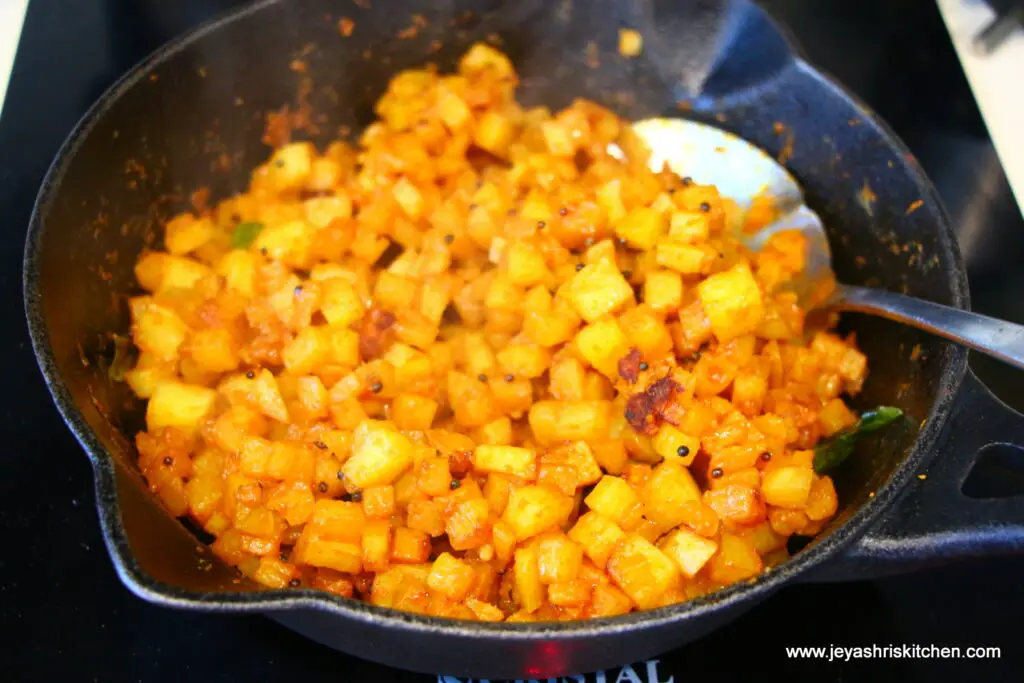 Potato fry on Cast Iron Kadai • - Essential Traditions